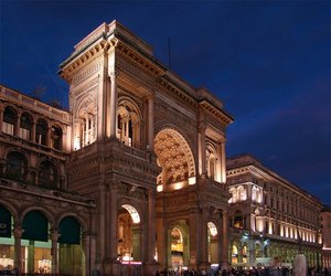 Arch at the entrance to the Galleria Vittorio Emanuele II at night